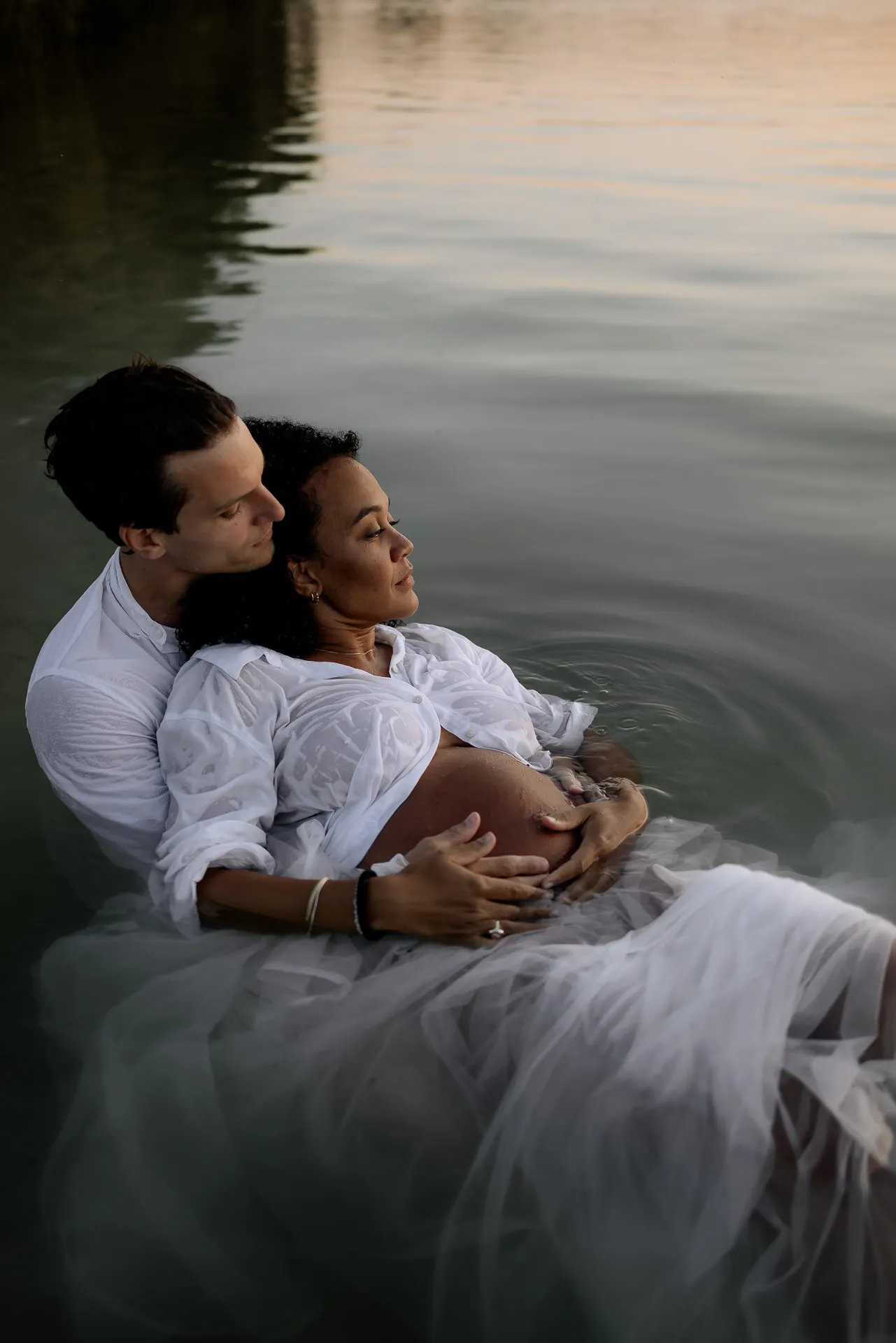 Modern maternity photography by the water