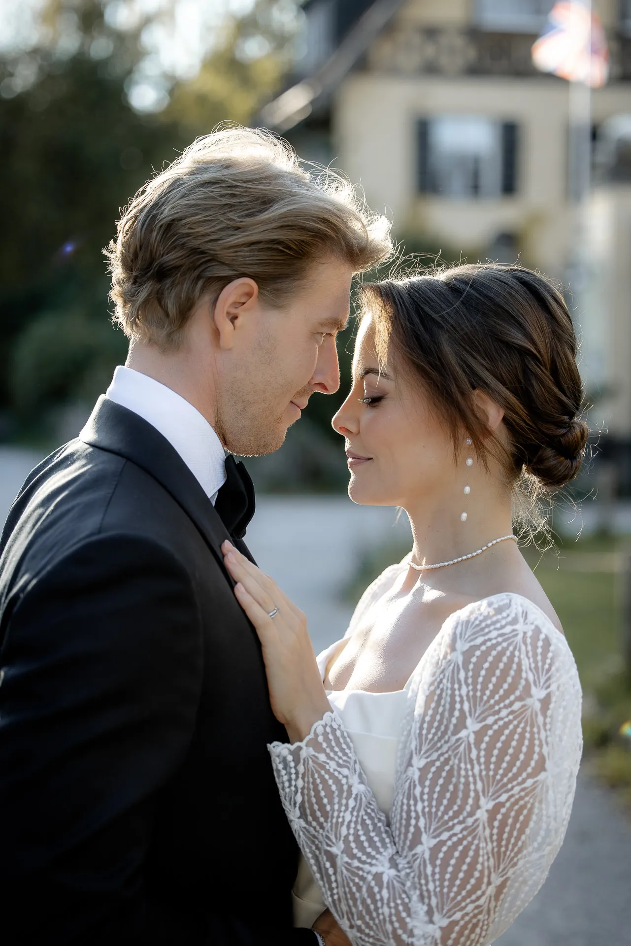 Intimate wedding couple portrait at Gut Sonnenhausen estate with soft backlight