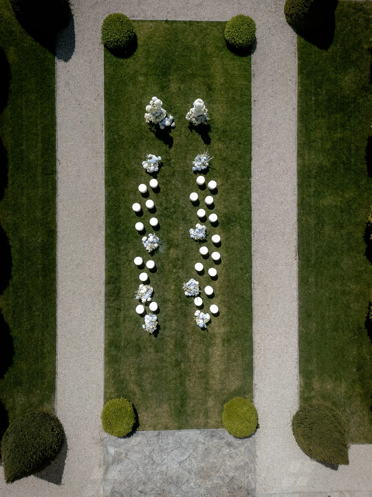 Aerial view of Villa Balbiano Lake Como wedding ceremony with symmetrical floral decoration