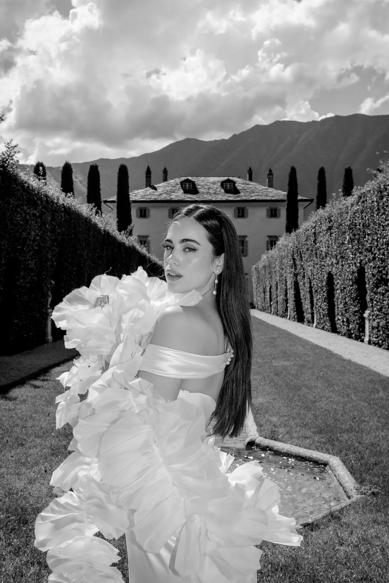 Black and white bridal portrait before Villa Balbiano with Italian cypresses