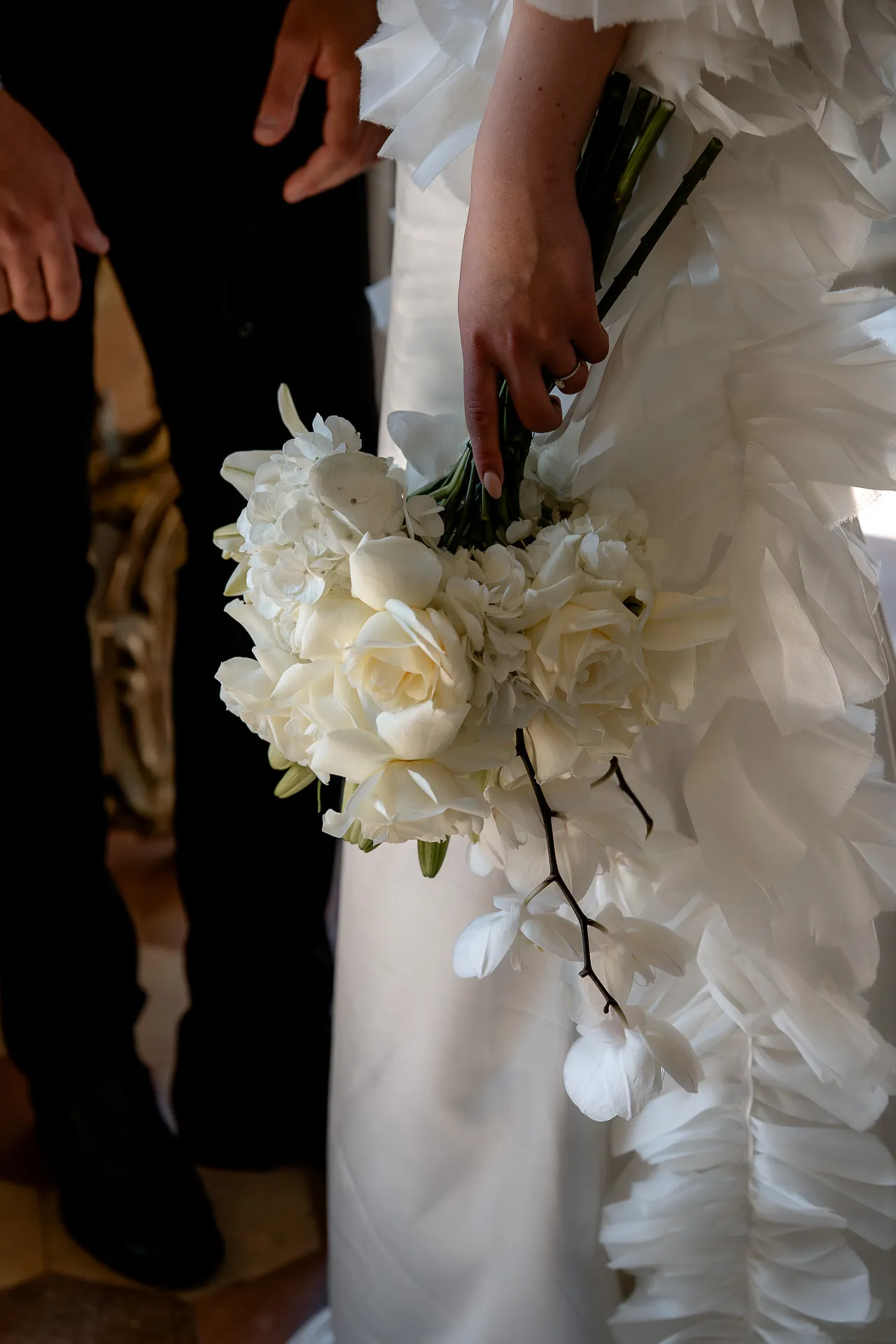Luxurious bridal bouquet with white roses and orchids at Villa Balbiano wedding