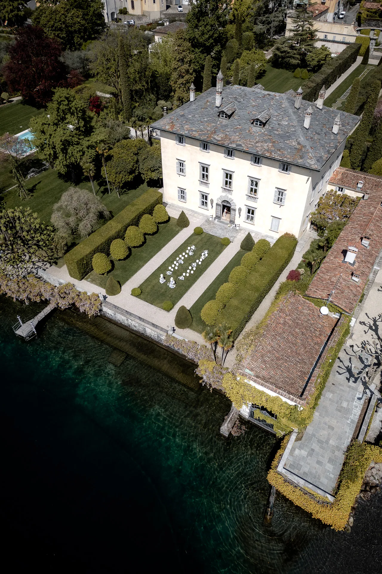 Drone shot of Villa Balbiano on Lake Como with wedding ceremony in garden