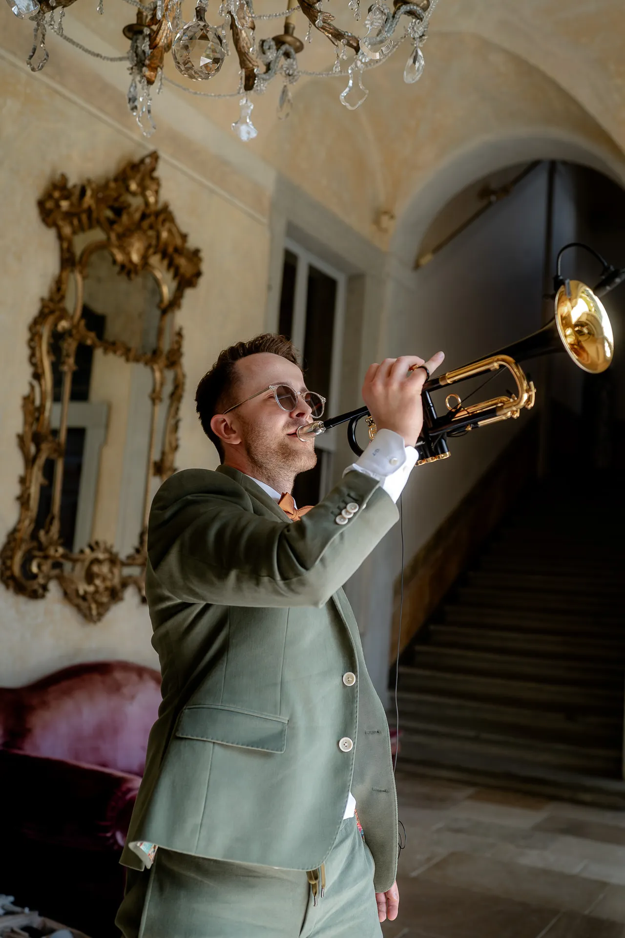 Trumpet player performing at wedding in historic Villa Balbiano