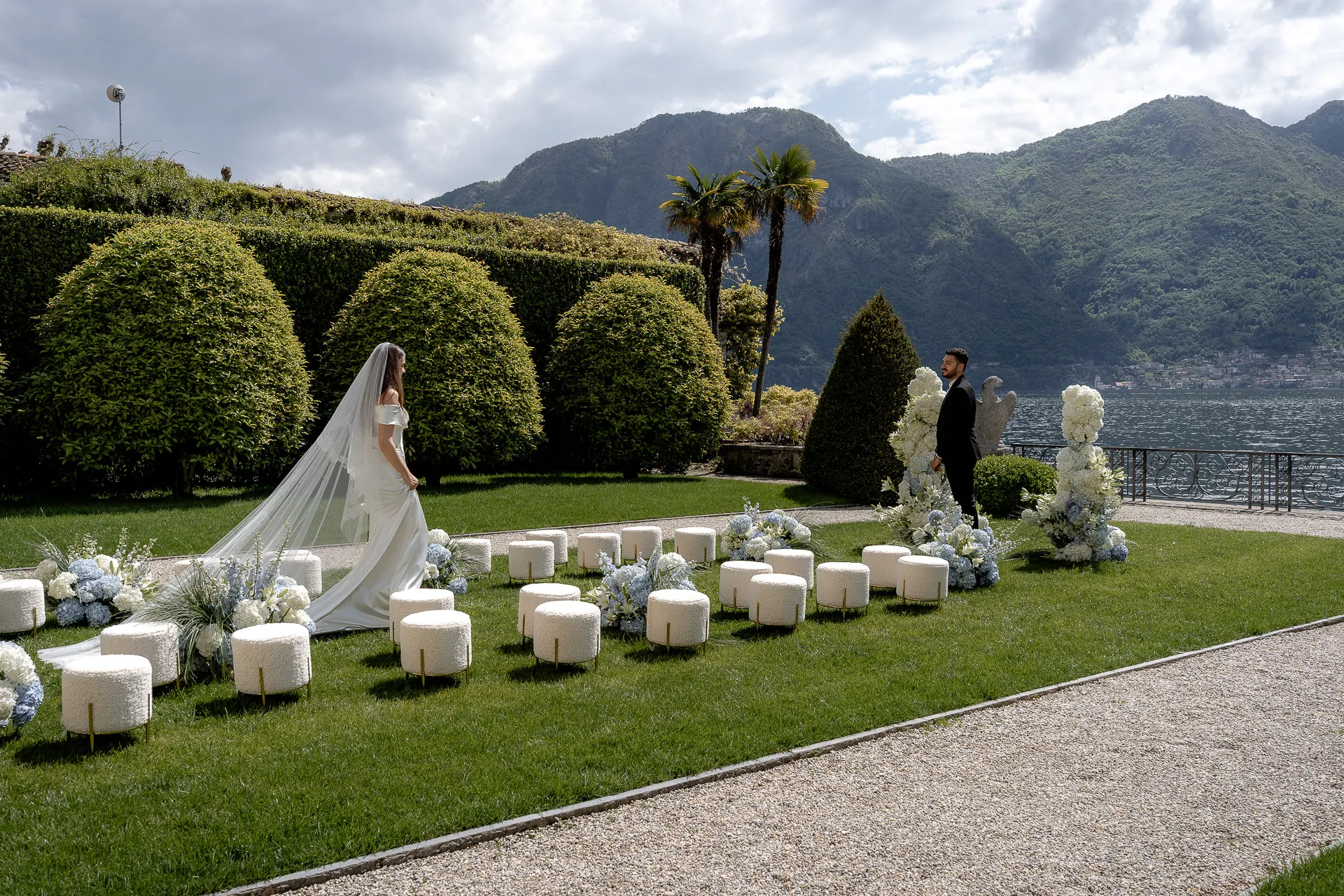 Wedding couple processional after ceremony at Lake Como with floral decoration