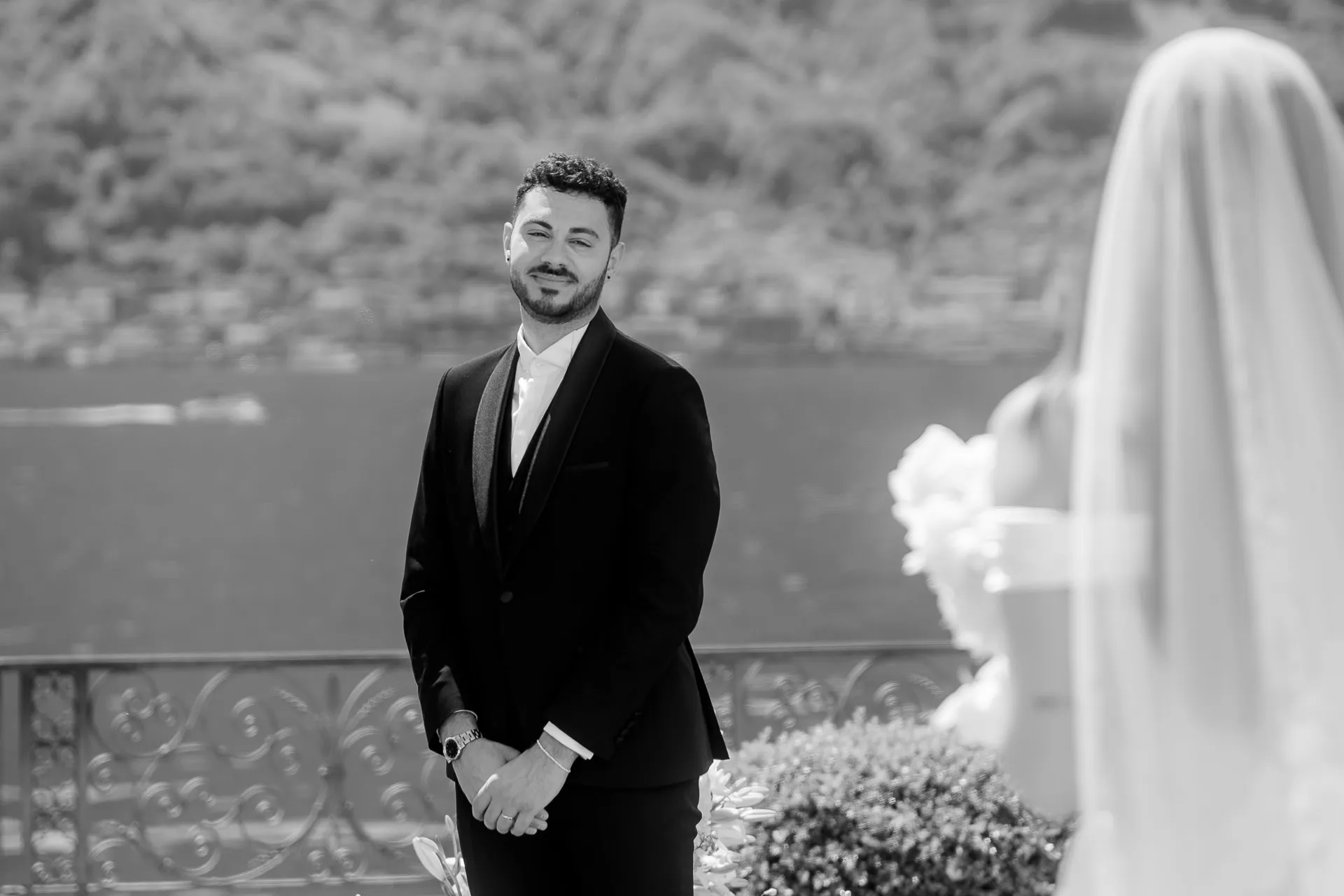 Emotional first look moment of groom black and white at Lake Como