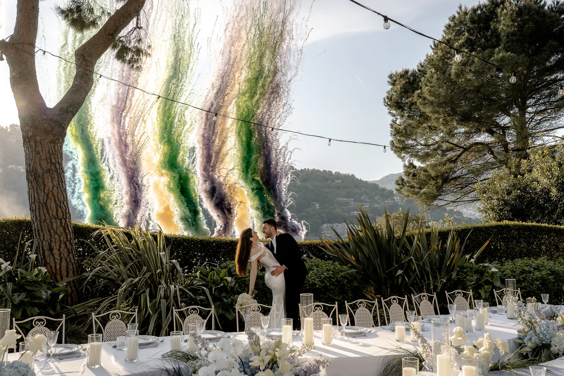 Wedding couple kiss with spectacular fireworks at Lake Como wedding