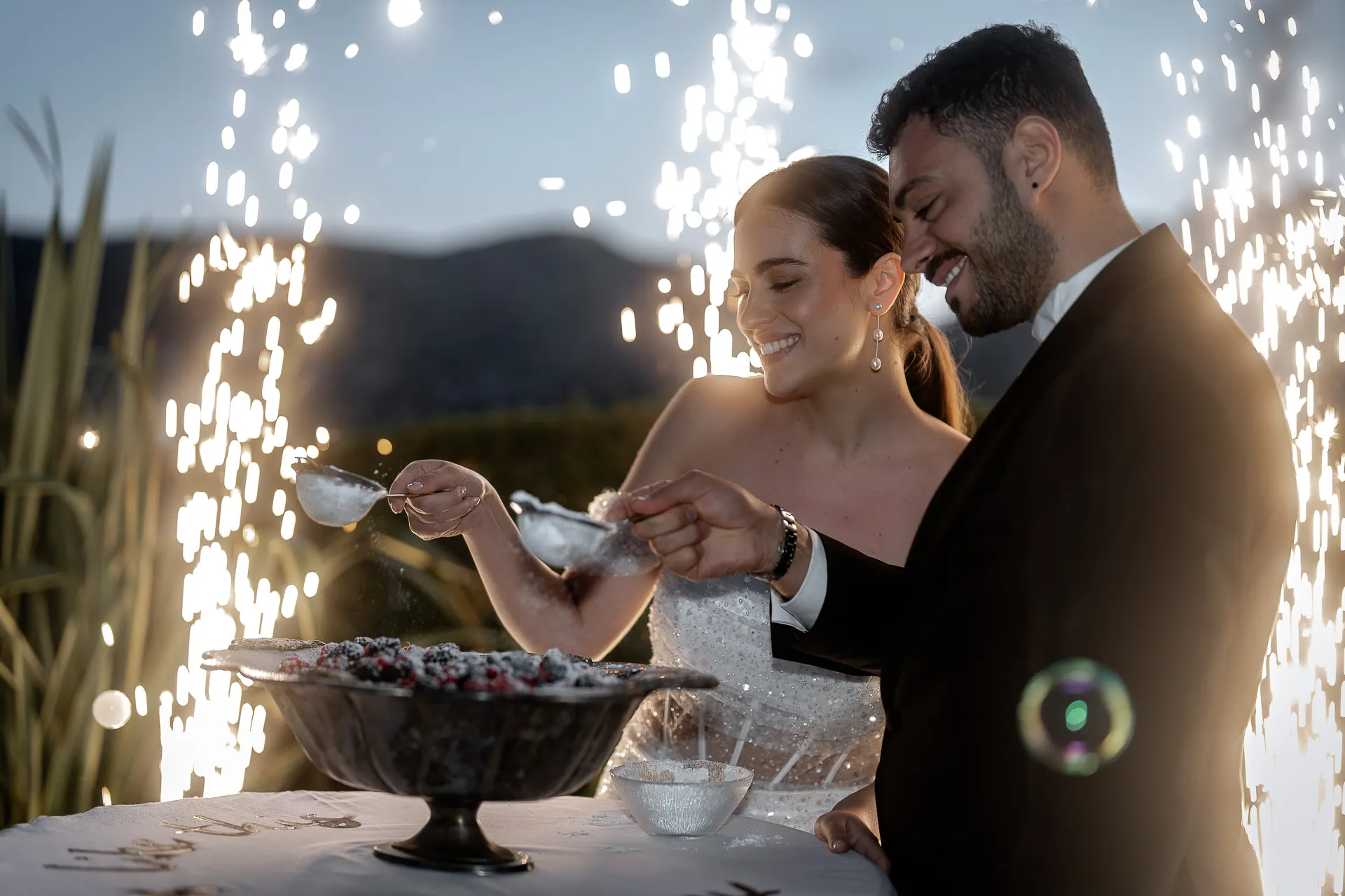 Wedding cake cutting with sparkler fountains at Lake Como wedding