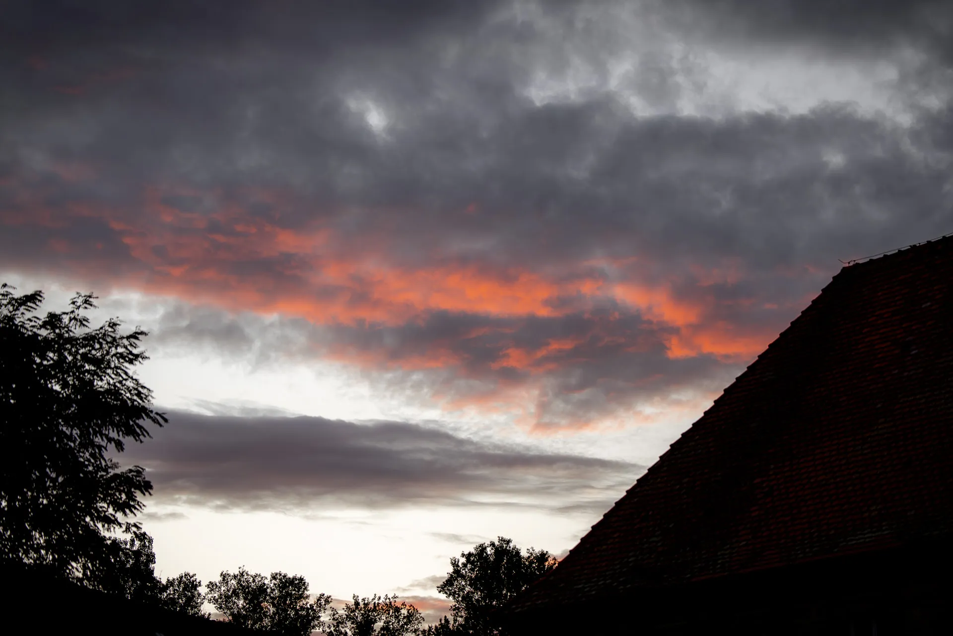 Dramatic evening sky with red clouds at wedding at Schloss Eyrichshof