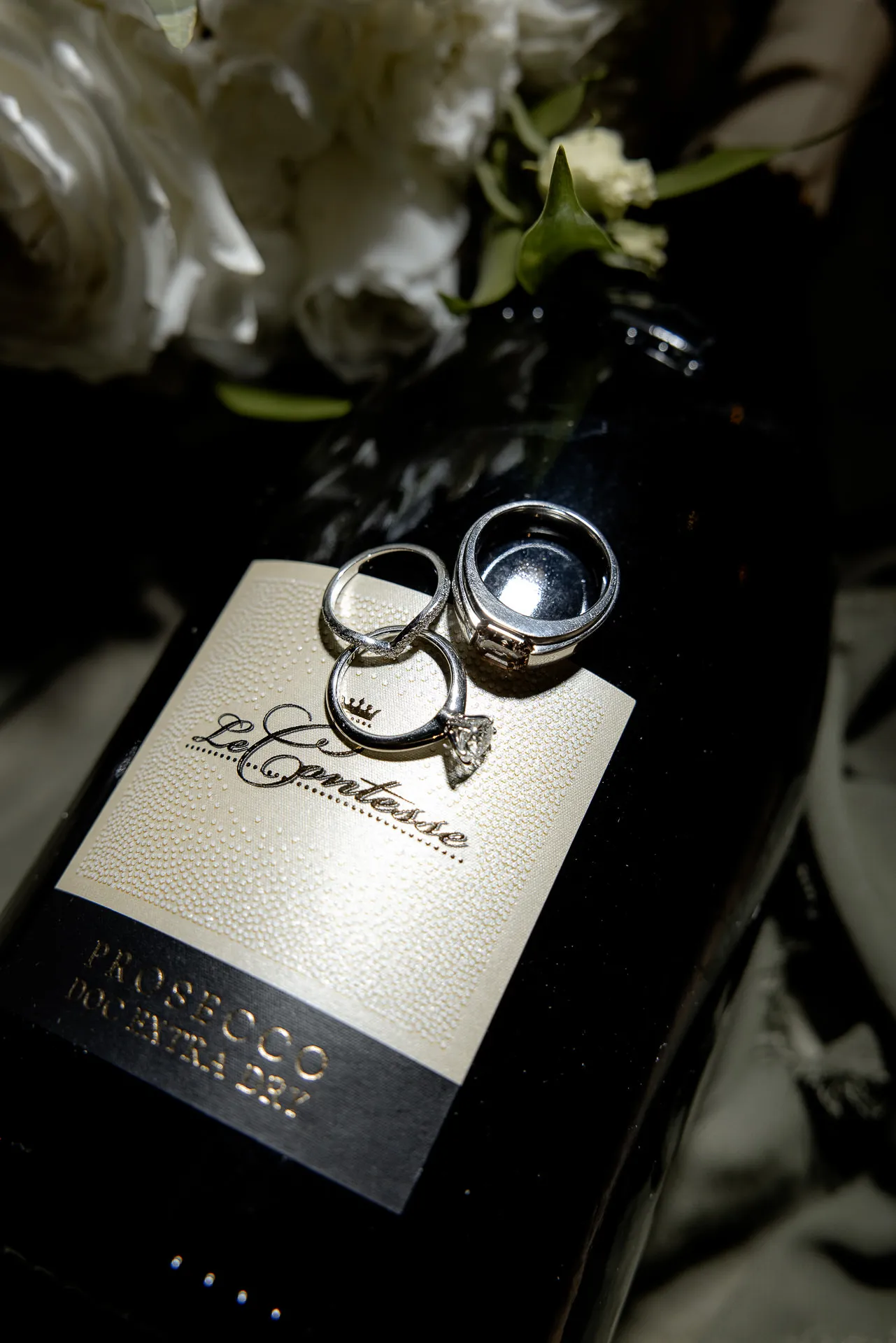 Elegant wedding rings with engagement ring on wedding invitation at castle wedding Eyrichshof