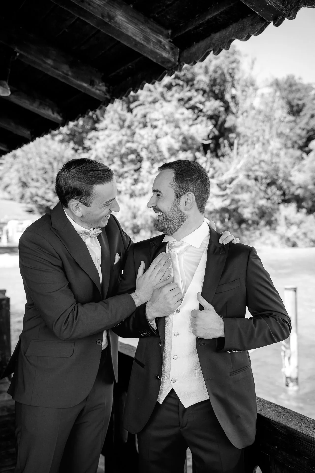 Emotional groom preparation with best man at La Villa lakeside wedding