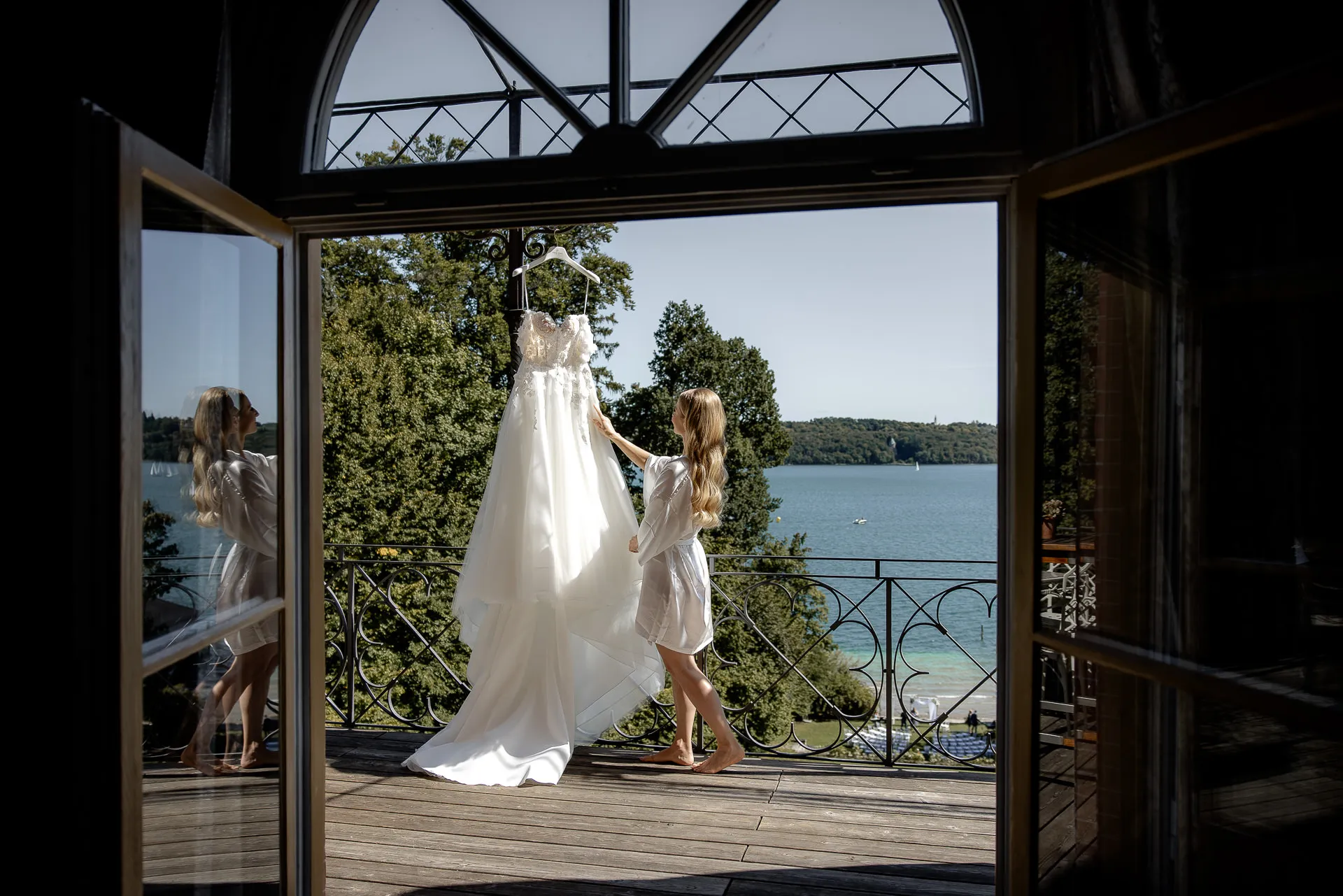 Wedding dress moment on balcony with lake view La Villa Starnberg