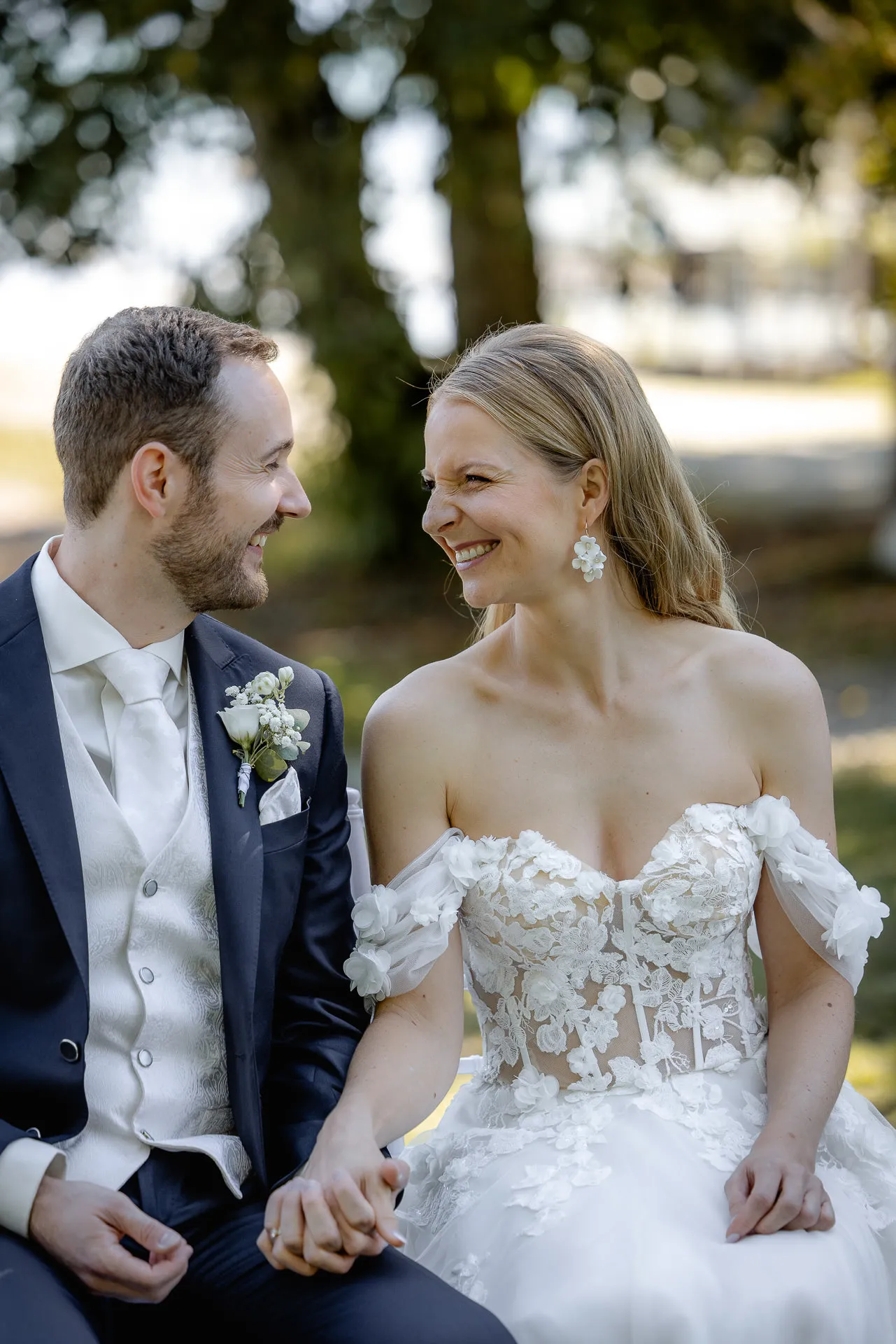 Happy couple sitting together smiling in La Villa garden