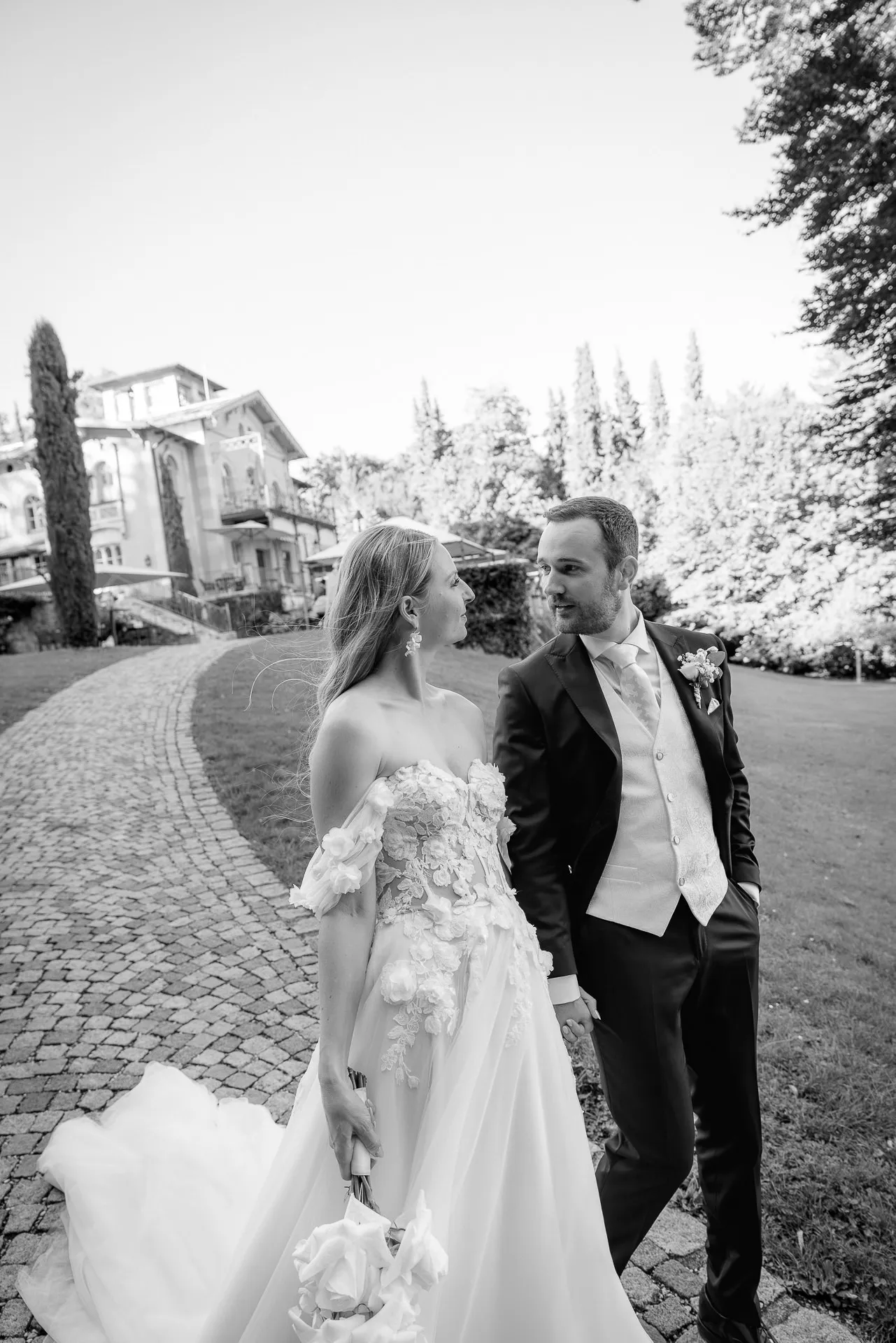 Romantic walk of couple black and white in La Villa park grounds