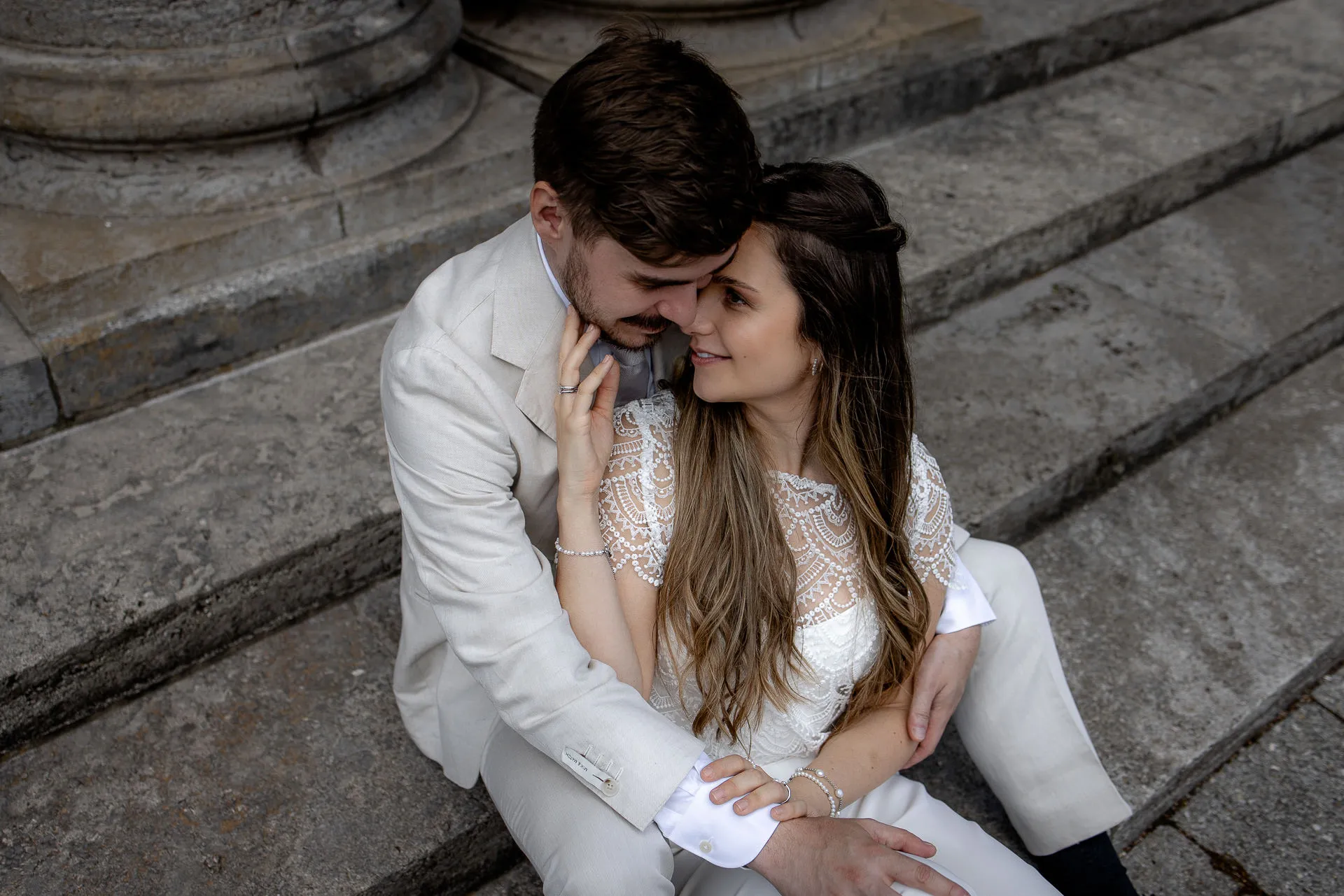 Intimate couple portrait on steps after ceremony Munich – romantic wedding photography