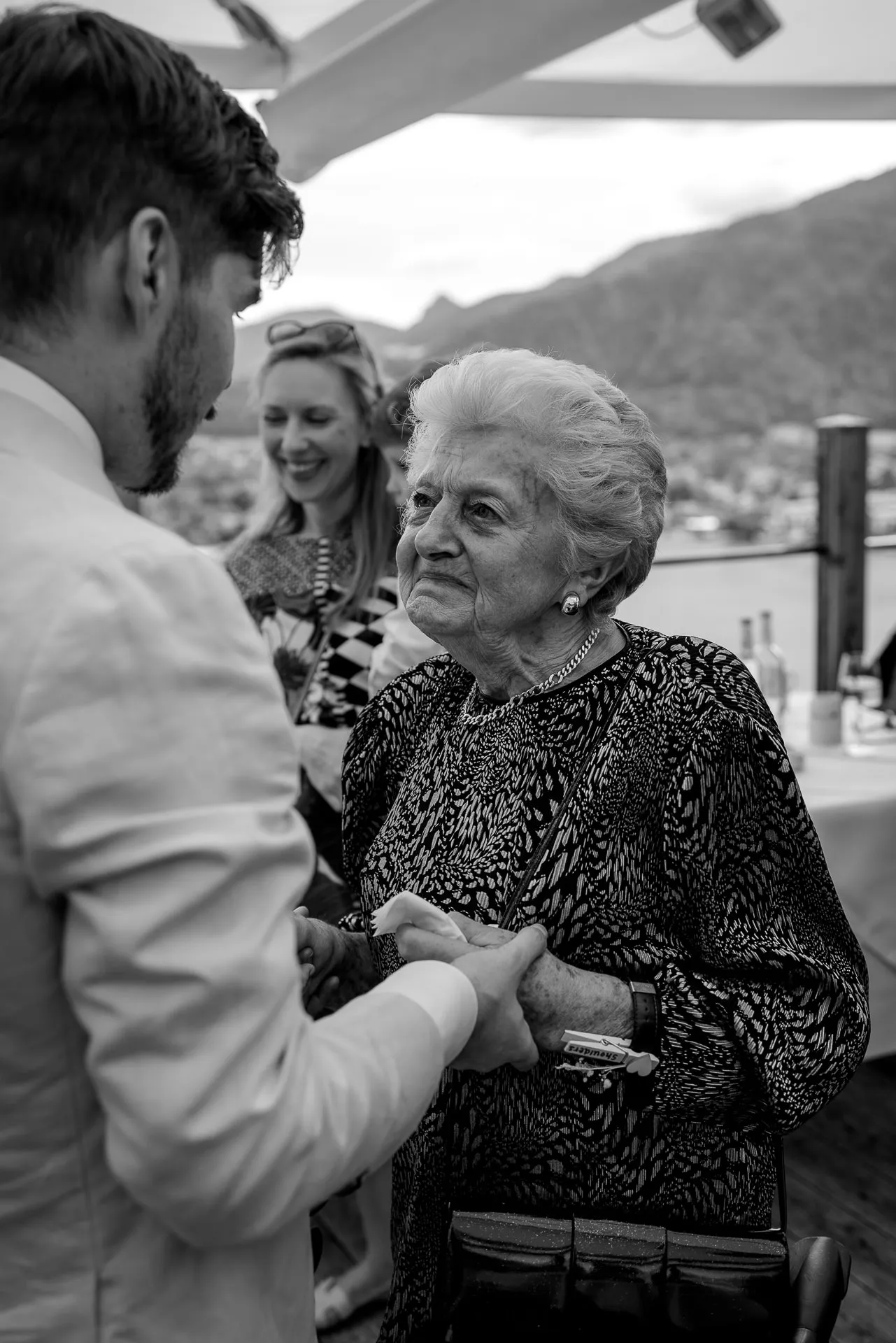 Emotional moment between groom and guest at Leeberghof wedding celebration – authentic photography