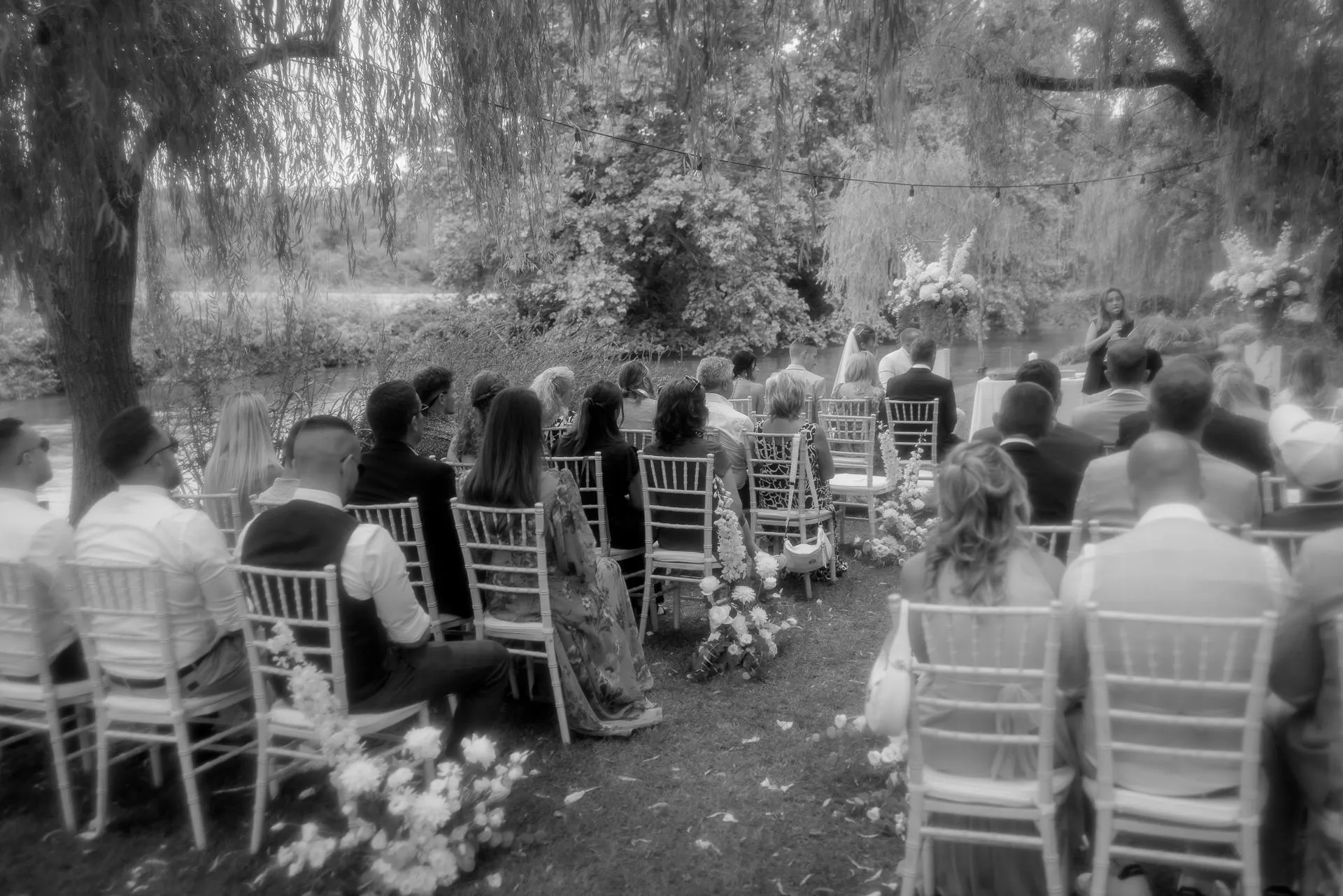 Romantic garden ceremony with guests at La Finestra sul Fiume in black and white
