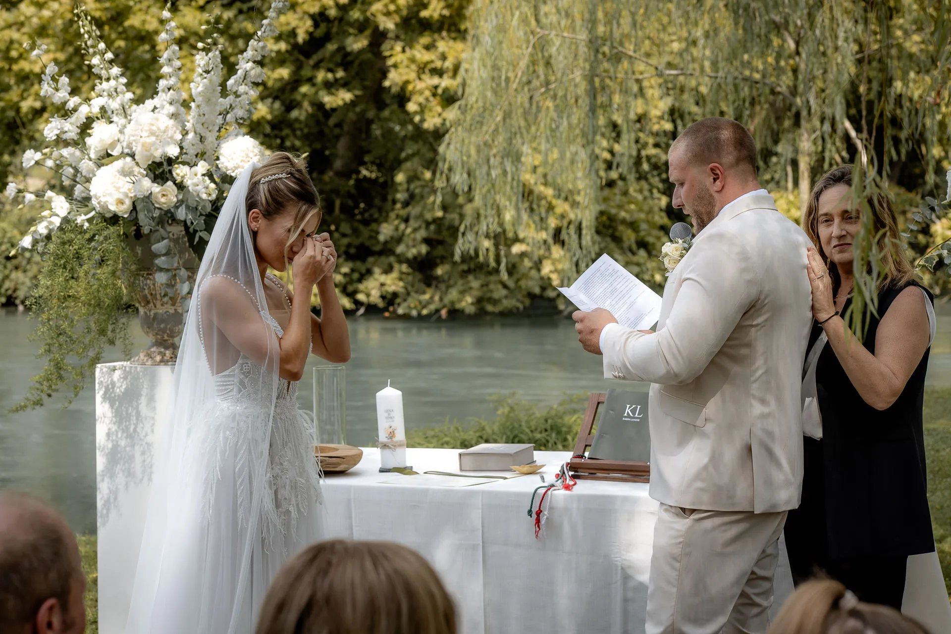 Tearful moment during wedding vows by the river in Italy