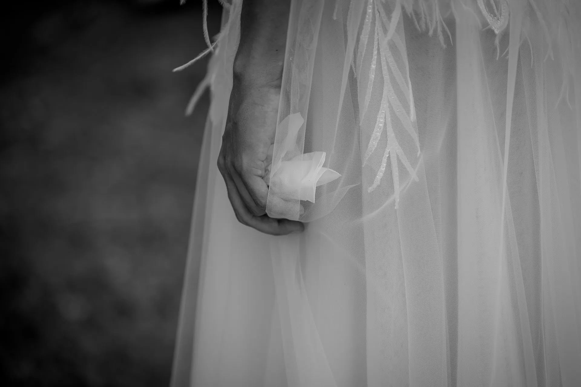 Emotional detail shot of bride with handkerchief in black and white