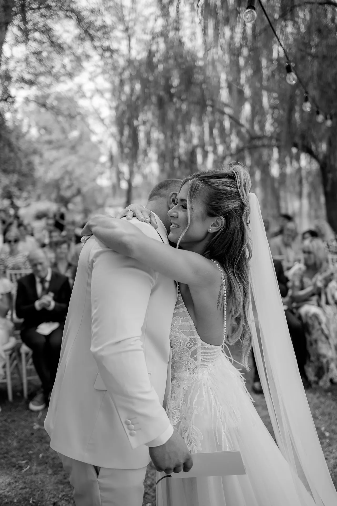 Joyful embrace of newlyweds after the ceremony
