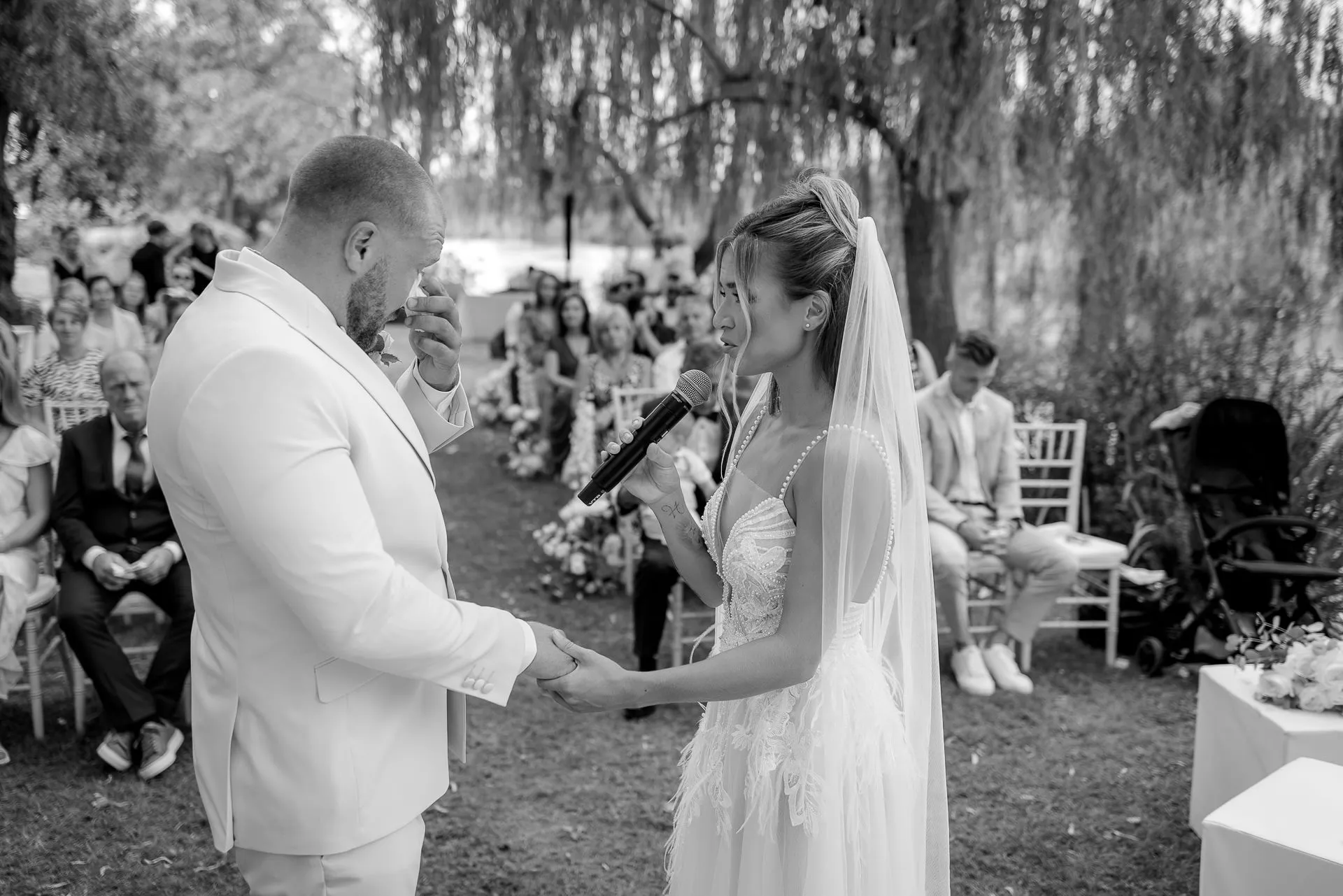 Moving moment during wedding vows with emotional groom