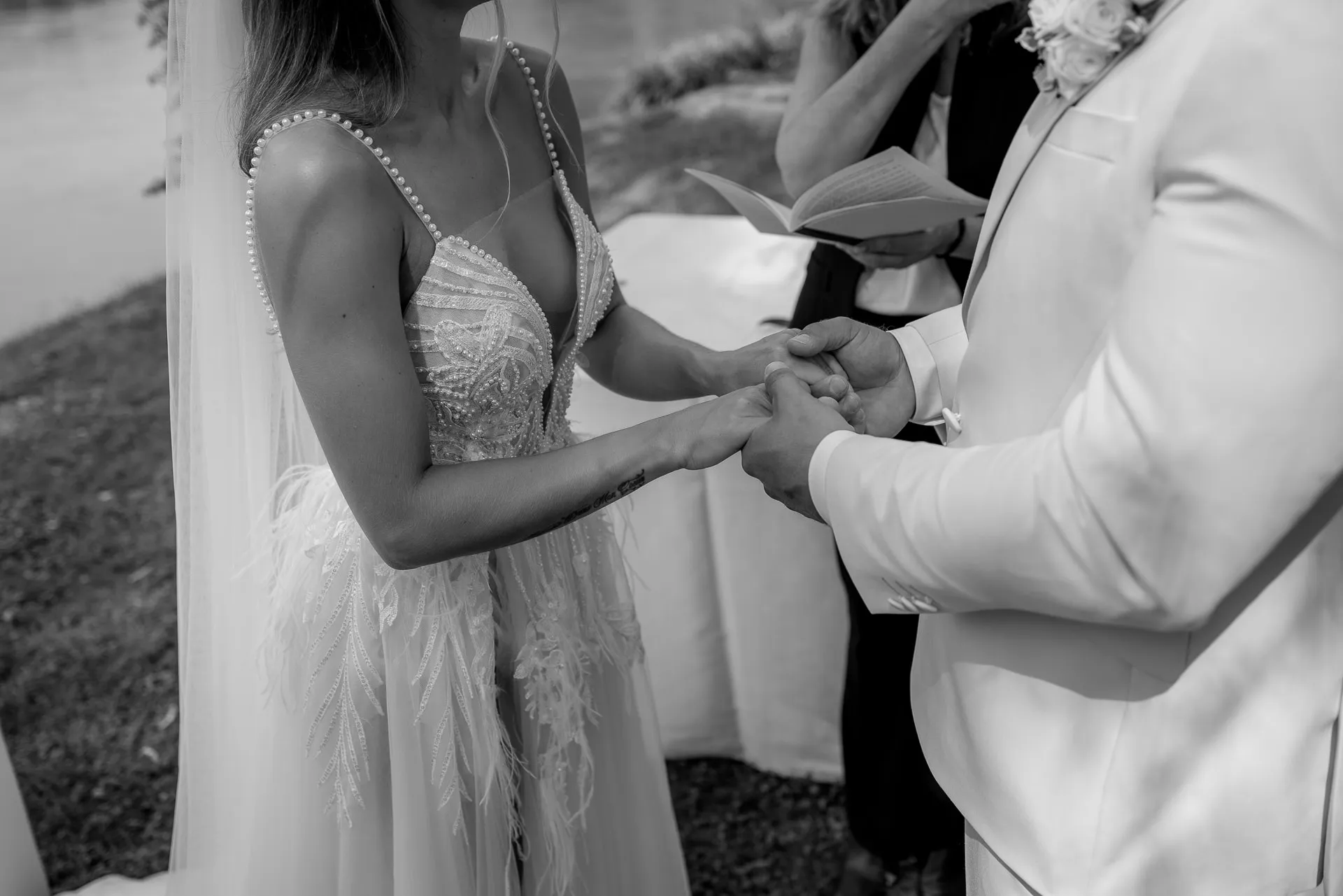 Ring exchange ceremony in black and white at Italian wedding
