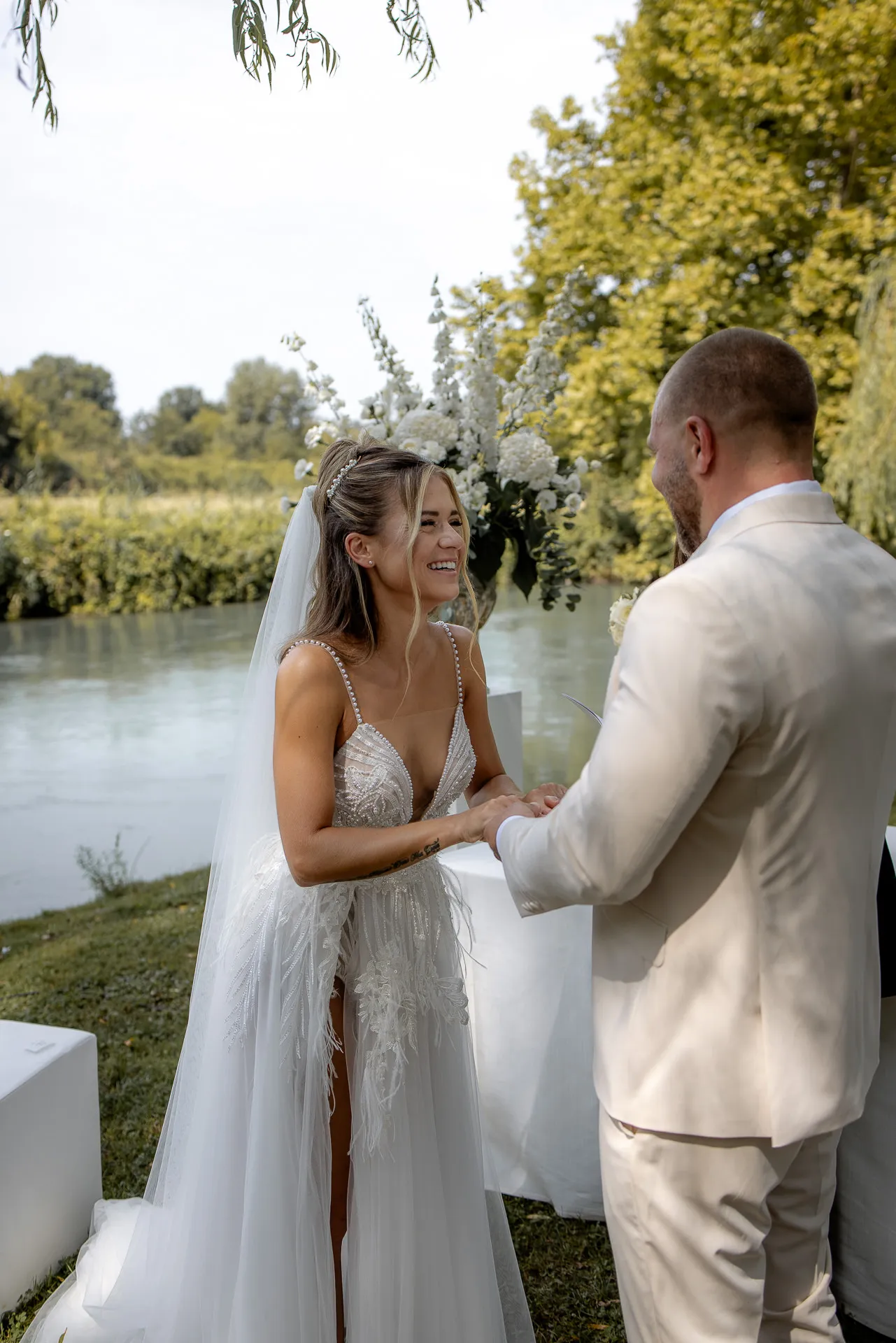 Radiant bride during wedding ceremony by the picturesque riverside