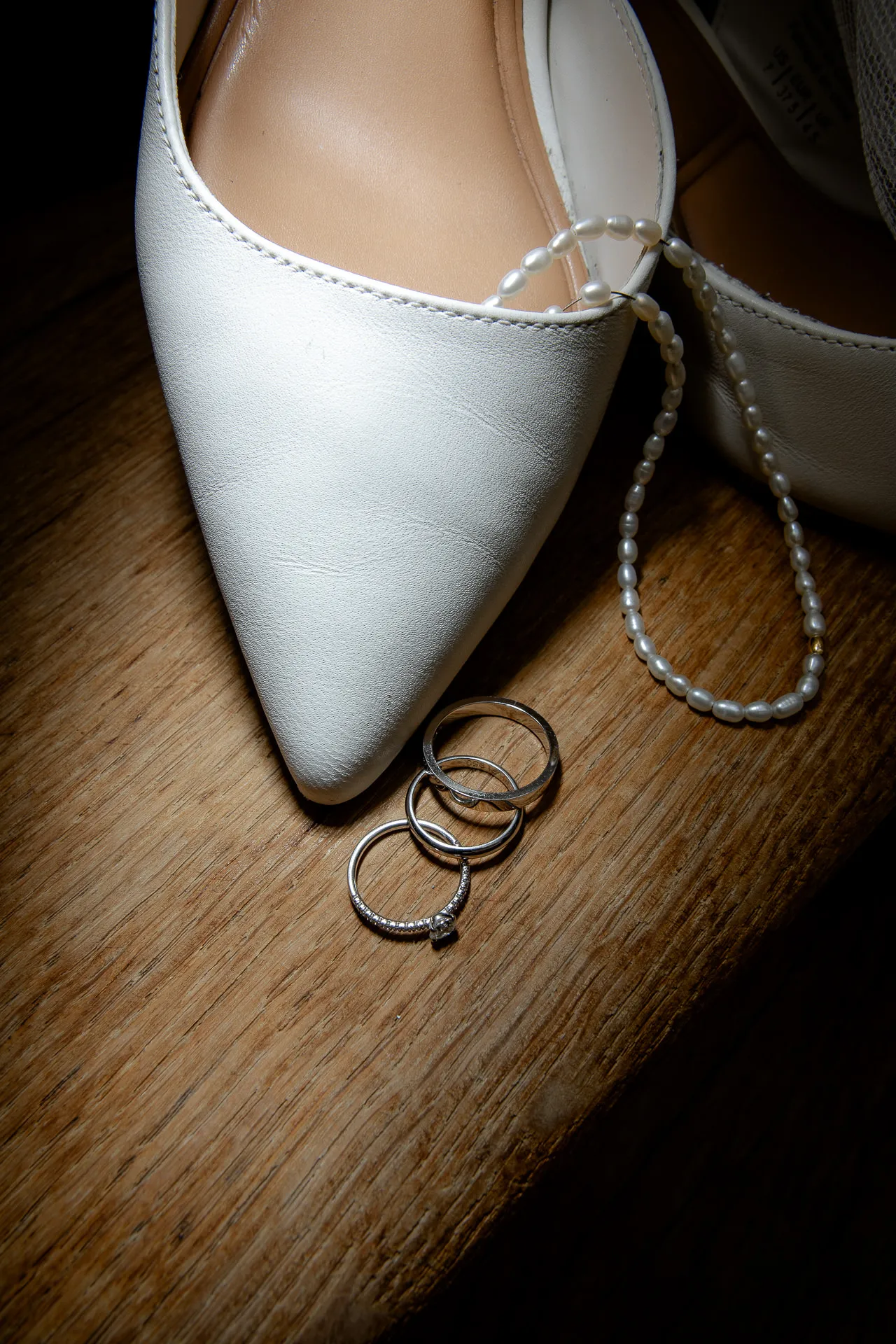 Bridal shoes and wedding rings detail shot at Gut Sonnenhausen wedding