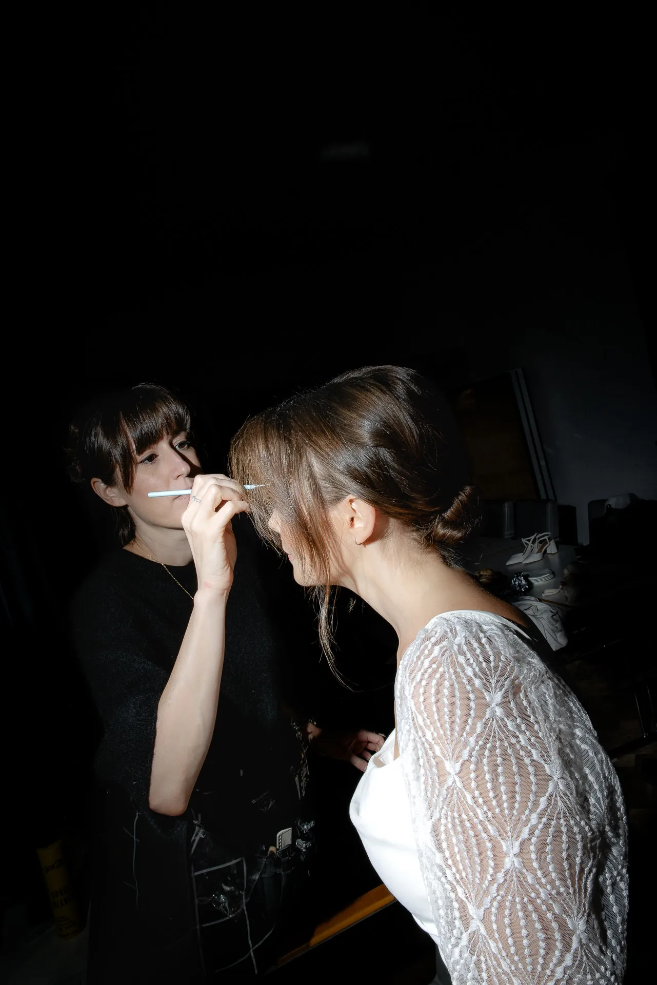 Bride getting eye makeup before wedding at Gut Sonnenhausen