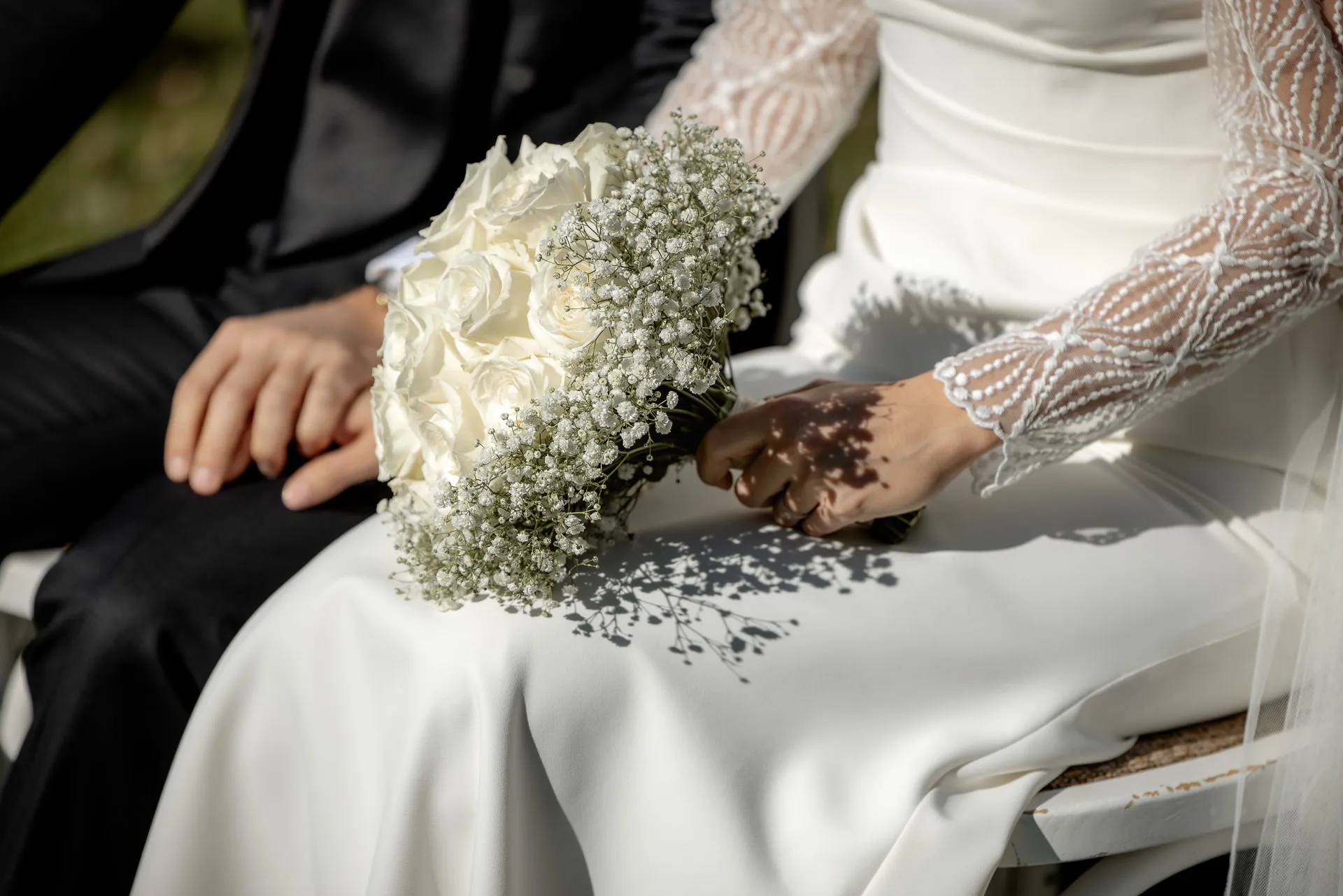Bridal bouquet with white roses and baby's breath at Gut Sonnenhausen wedding