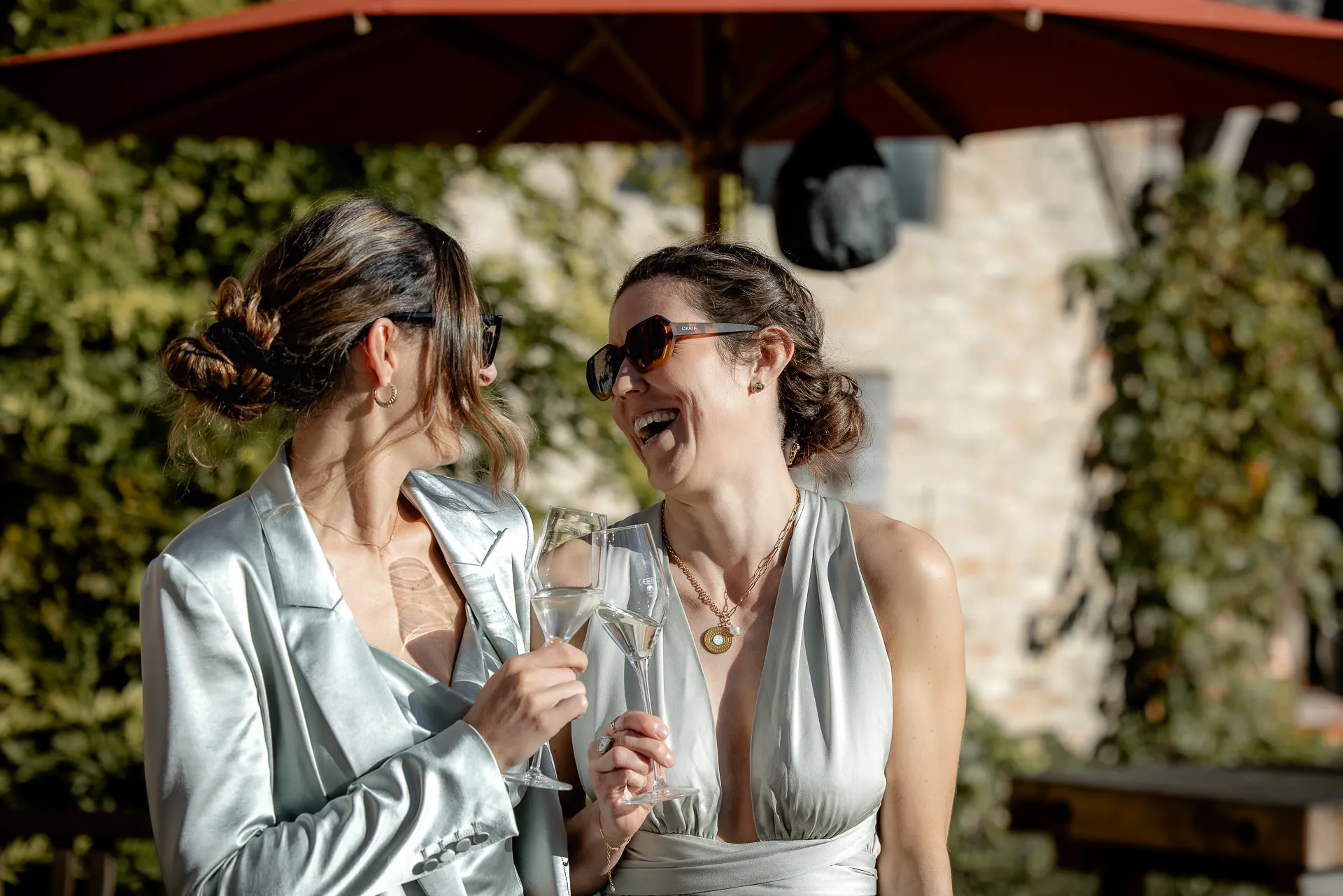Wedding guests toasting with champagne at celebration at Gut Sonnenhausen country wedding