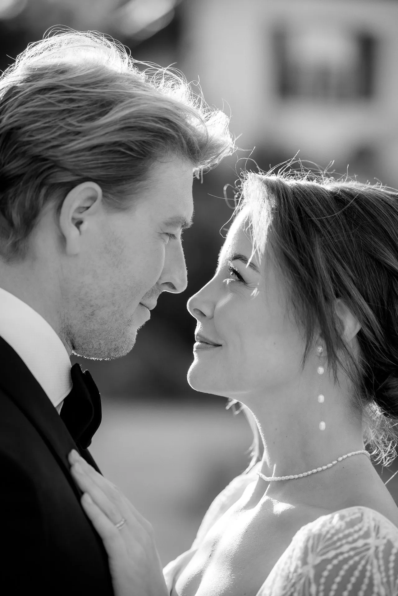 Romantic bride and groom looking at each other at Gut Sonnenhausen wedding in black and white