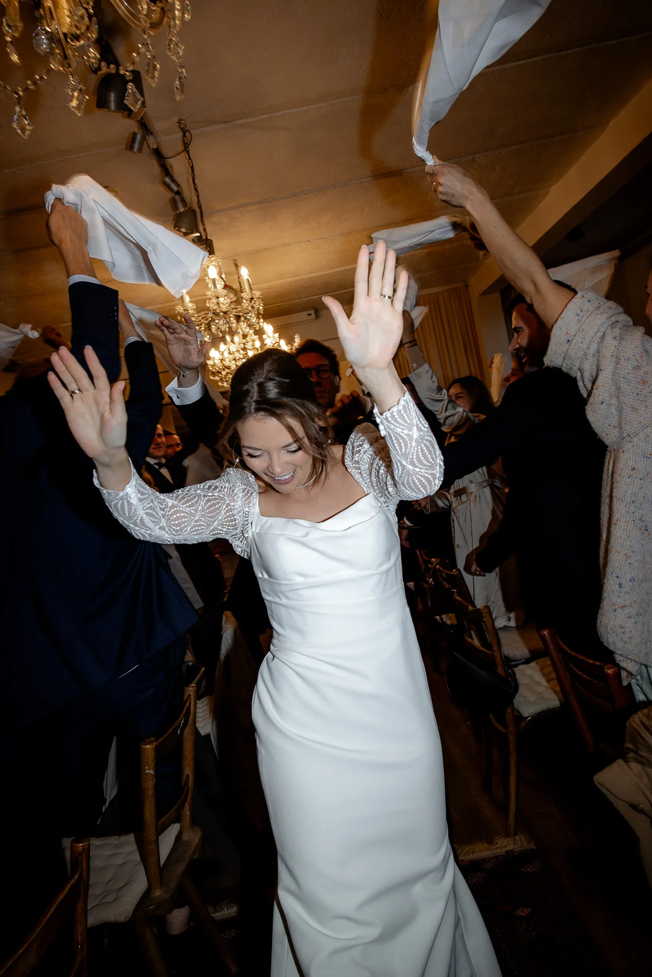 Joyful bride dancing exuberantly at wedding celebration at Gut Sonnenhausen