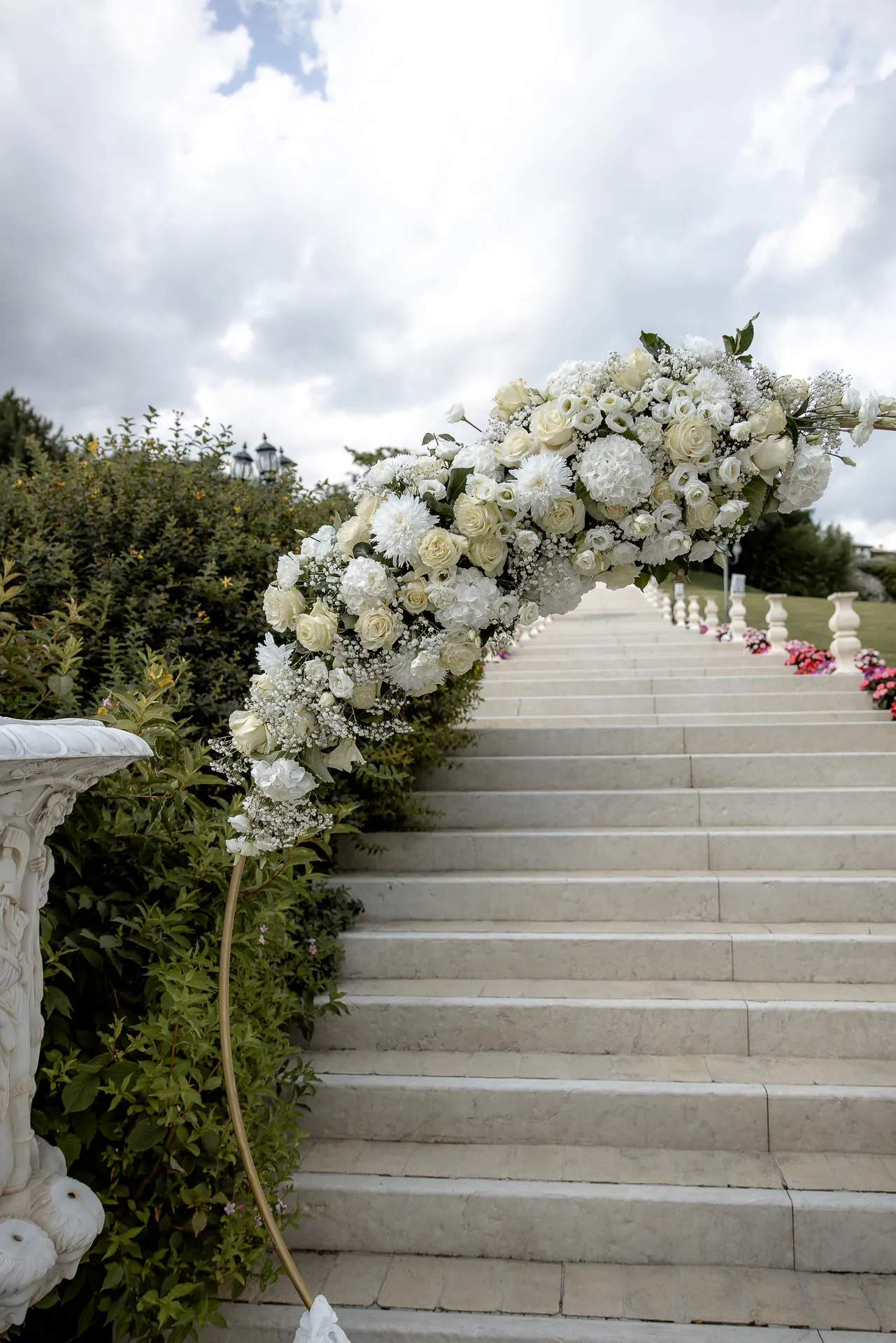Magnificent flower decoration with white roses on staircase at Villa Cariola