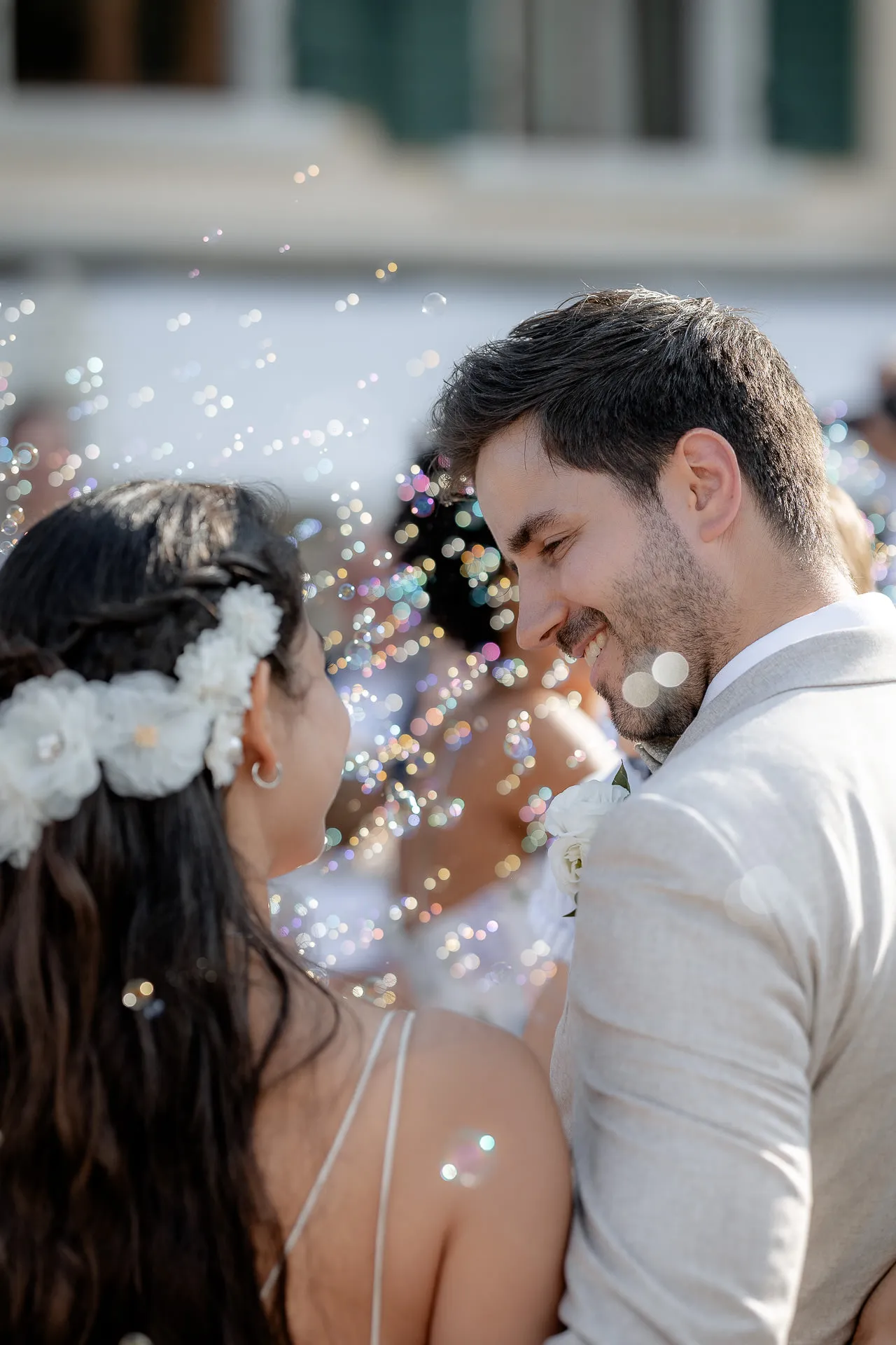 Newly married couple surrounded by colorful soap bubbles at Villa Cariola