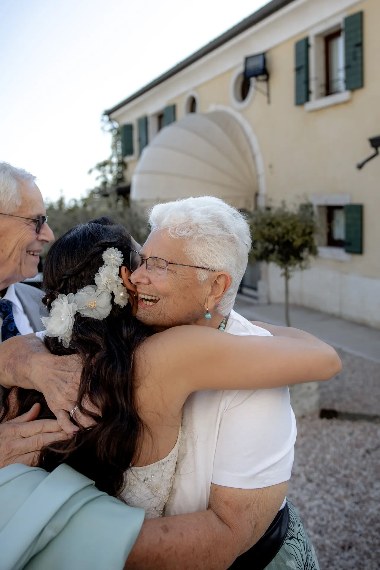 Joyful bride embracing grandmother after ceremony at Villa Cariola