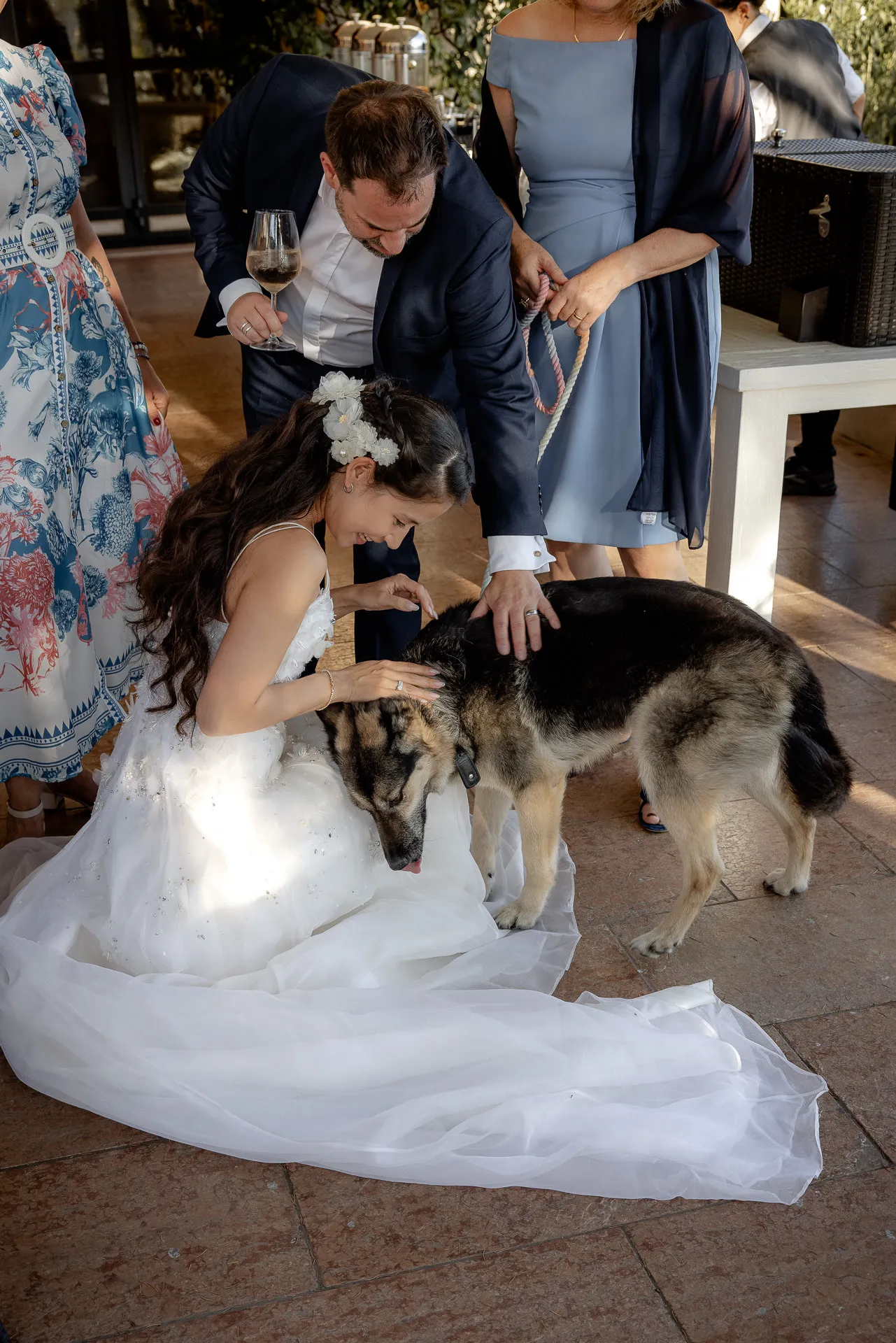 Wedding couple with dog at emotional celebration at Villa Cariola