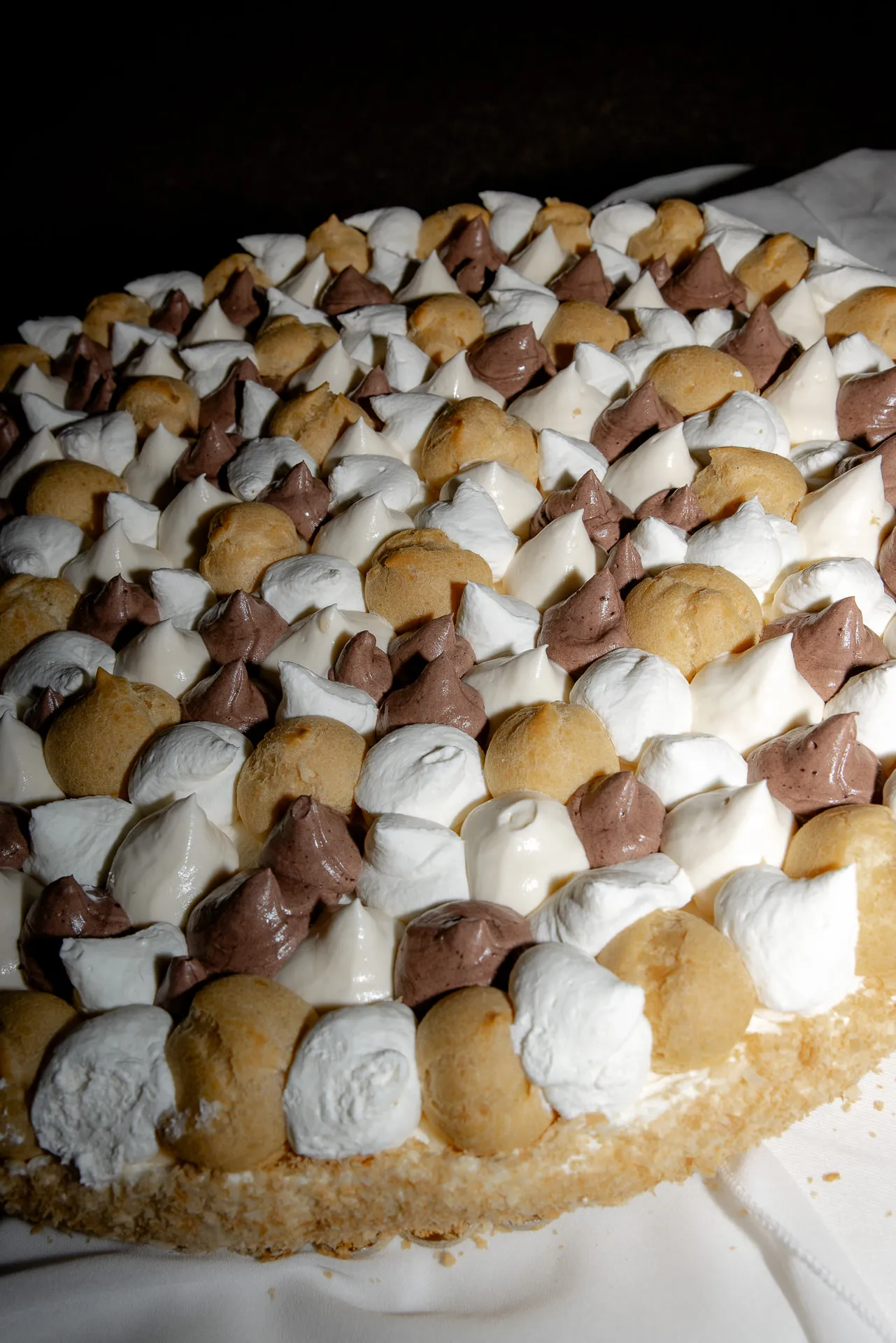 Emotional kiss of bride and groom during wedding ceremony in Italy
